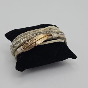 NWT 2 Chic cream and silver layered wrap bracelet with gold tone feather